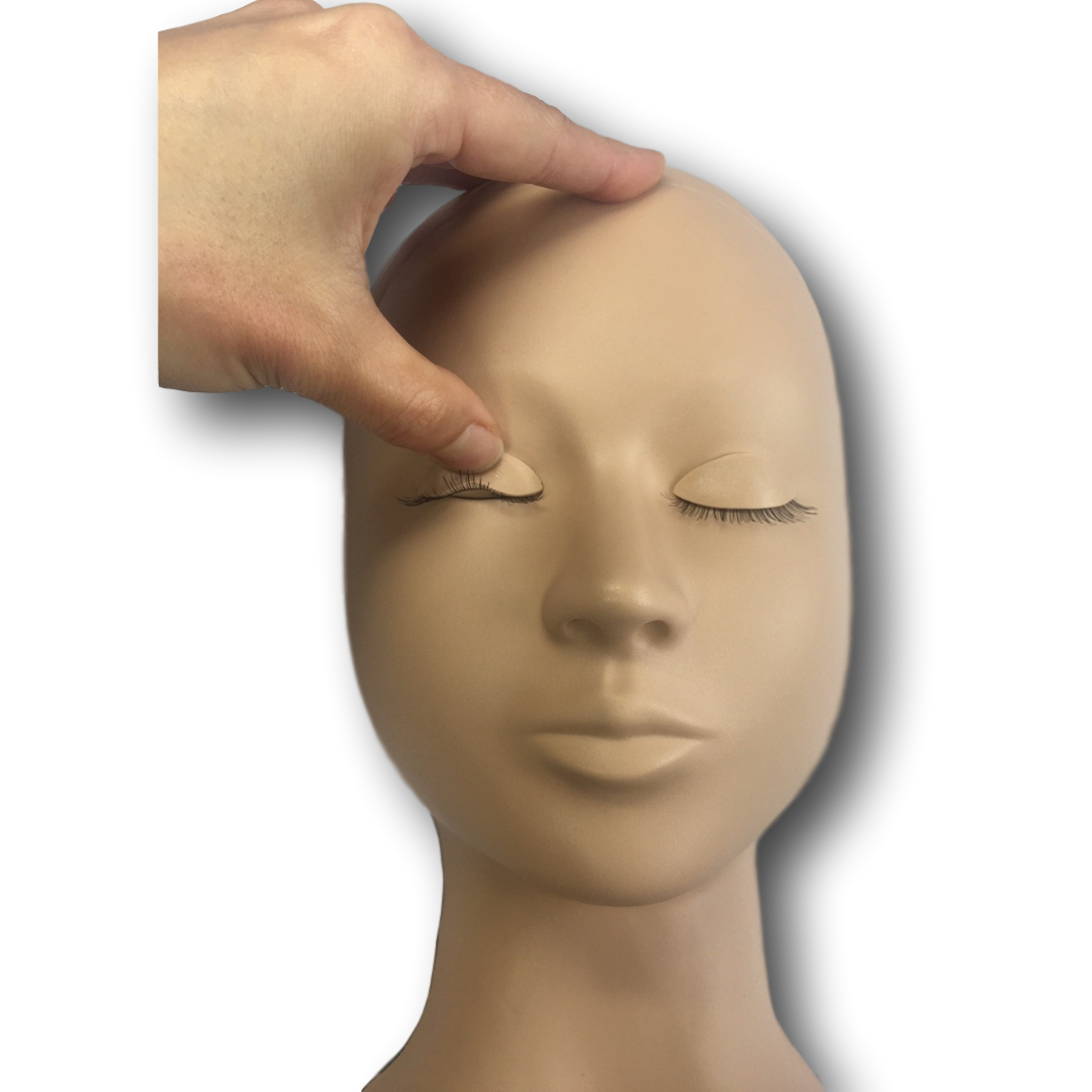 Thumb Pulling the eyelid of a GLB advanced Training Mannequin